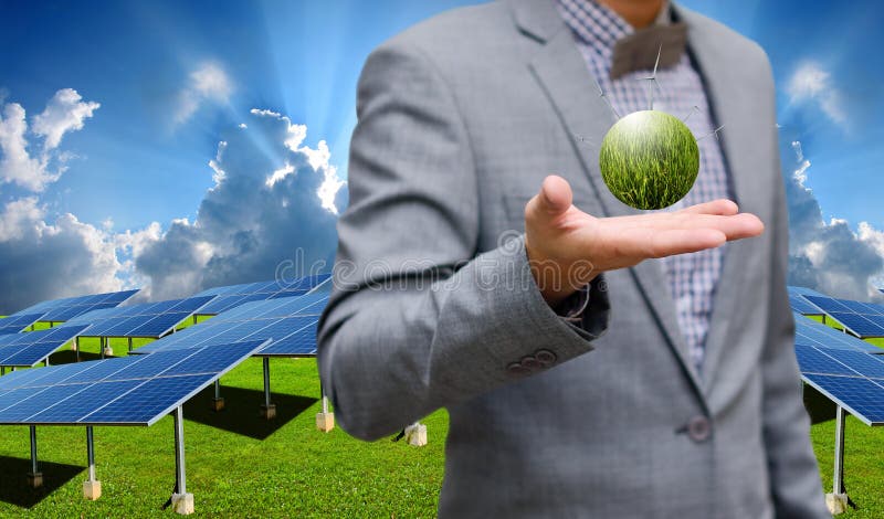 Green energy concept, Businessman carry world of wind turbine