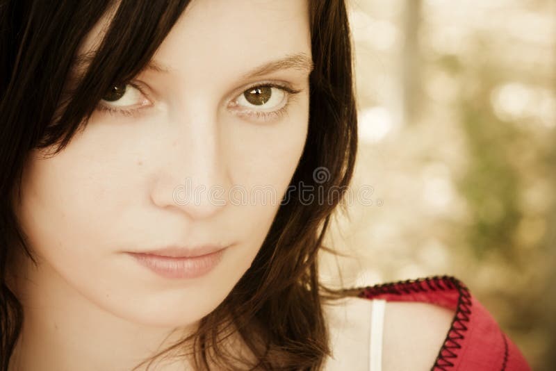 Green eyed woman staring at camera