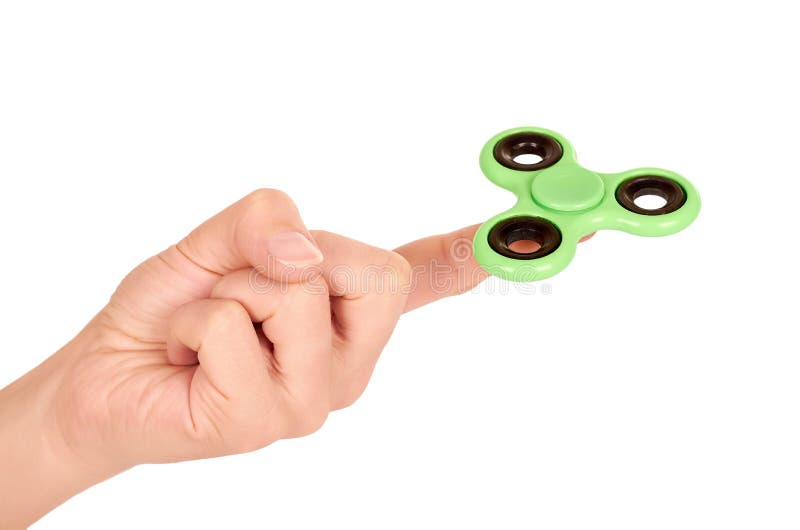 Green fidget spinner in hand isolated on white background stock image Green fidget spinner in hand isolated on white background stock image