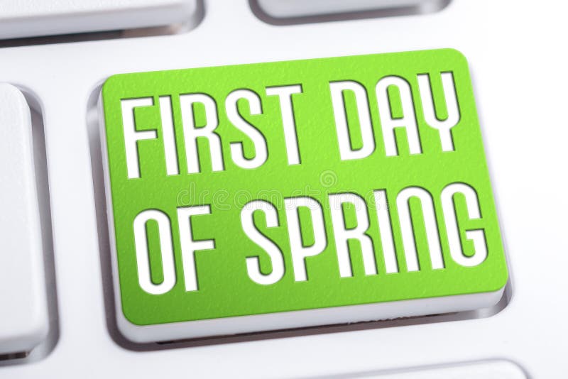 Green First Day Of Spring Button On A White Keyboard stock images