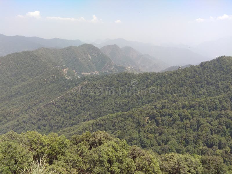 Green forest and hills with green nature with small village in mountain area stock photography Green forest and hills with green nature with small village in mountain area stock photography