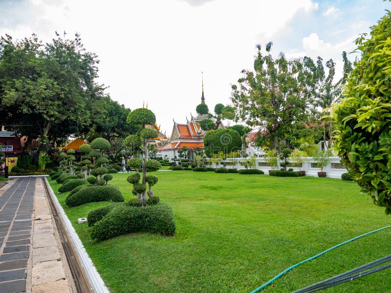 Green garden in the temple area and Add up peace Mentally,Temple name is Wat Arun Ratchawararam Woramahaviharn at Bangkok Thailand stock photo Green garden in the temple area and Add up peace Mentally,Temple name is Wat Arun Ratchawararam Woramahaviharn at Bangkok Thailand stock photo