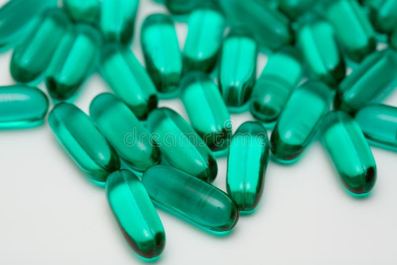 Green gel pills stock image. Image of capsule, diet, multivitamin 621833