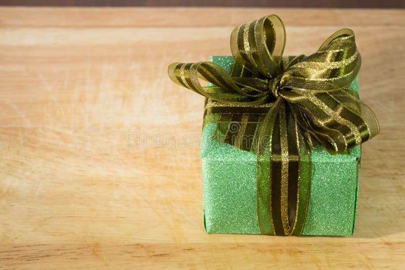 Olive green gift box stock image. Image of hand, party 42846827