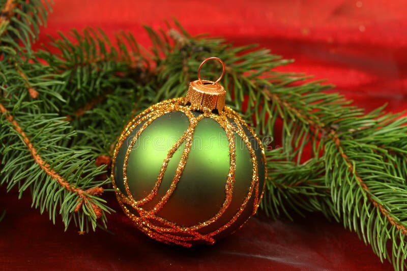 Green glass ball in Christmas wreath