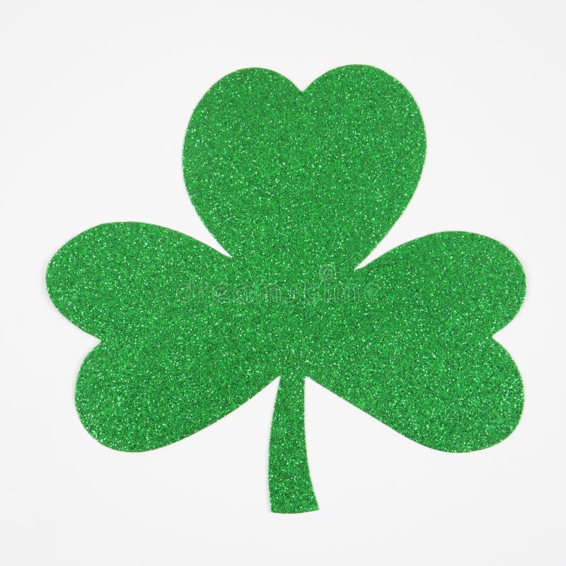 Green glitter paper shamrock on white. Green glitter paper shamrock on white.