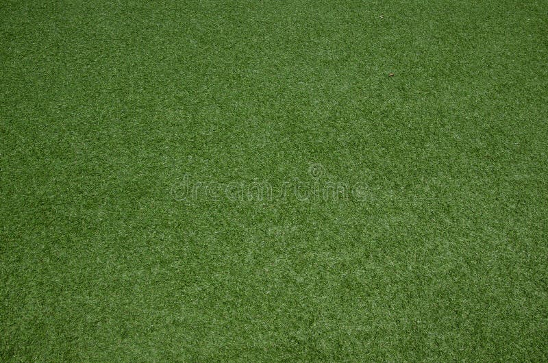 Close up artificial green grass turf texture background