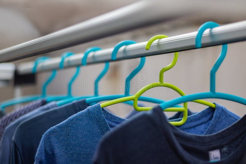 Green Hanger Plastic in the Clothes Array with a Blue Hanger Plastic