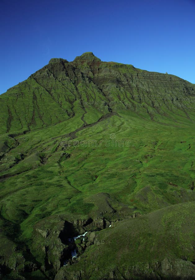 Green hill, blue sky