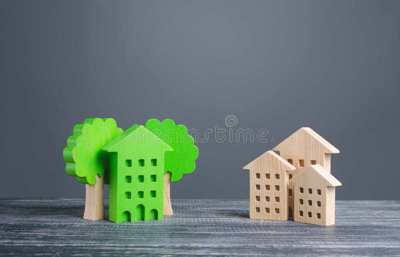 Green house with trees and ordinary residential buildings. Energy efficiency, profitability in maintenance. Zero carbon emissions, conservation, energy saving. Developed infrastructure, park areas