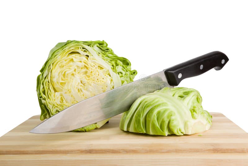 Green iceberg lettuce with knife on wooden choppin