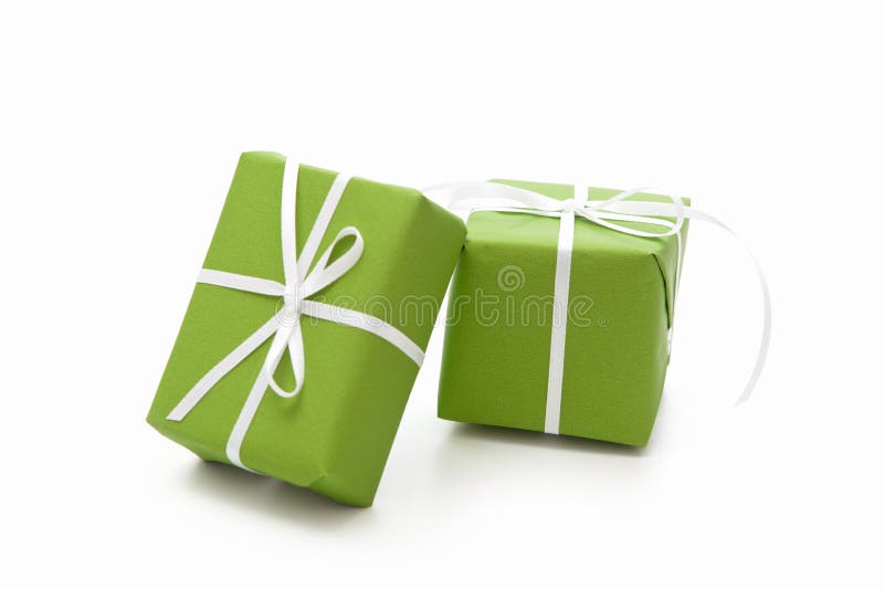 Green isolated giftboxes tied with white ribbon for christmas