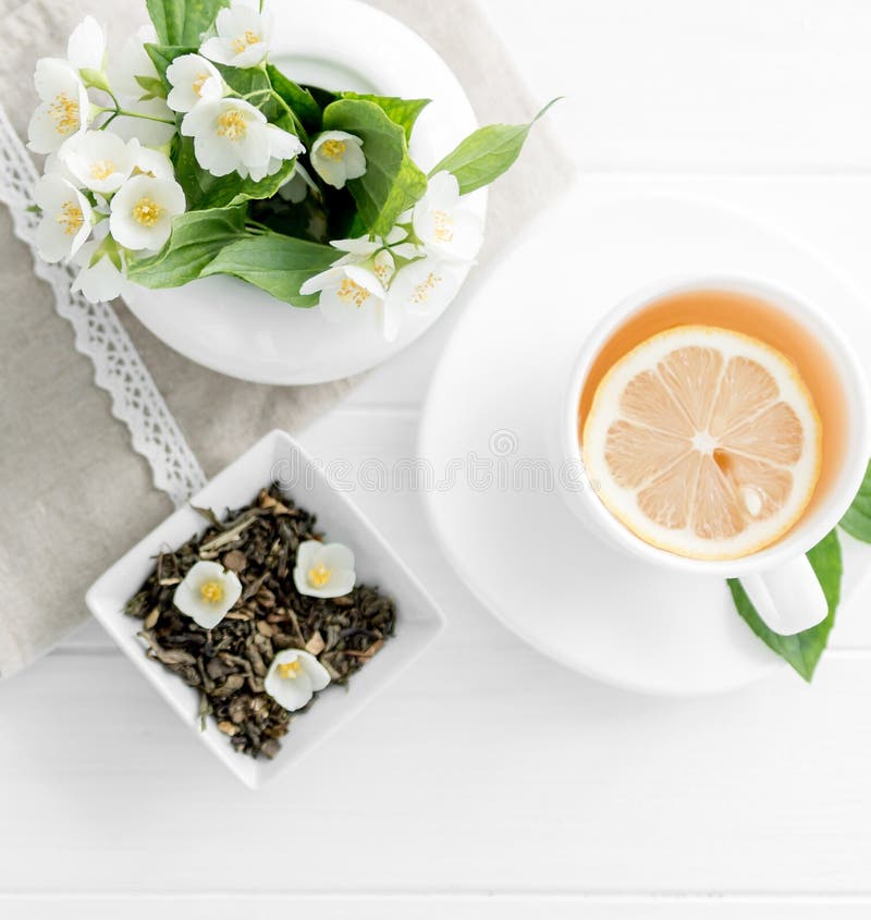 Green Tea with Jasmine Flowers Pouring from Glass Teapot in Cup Stock Photo Image of blossom
