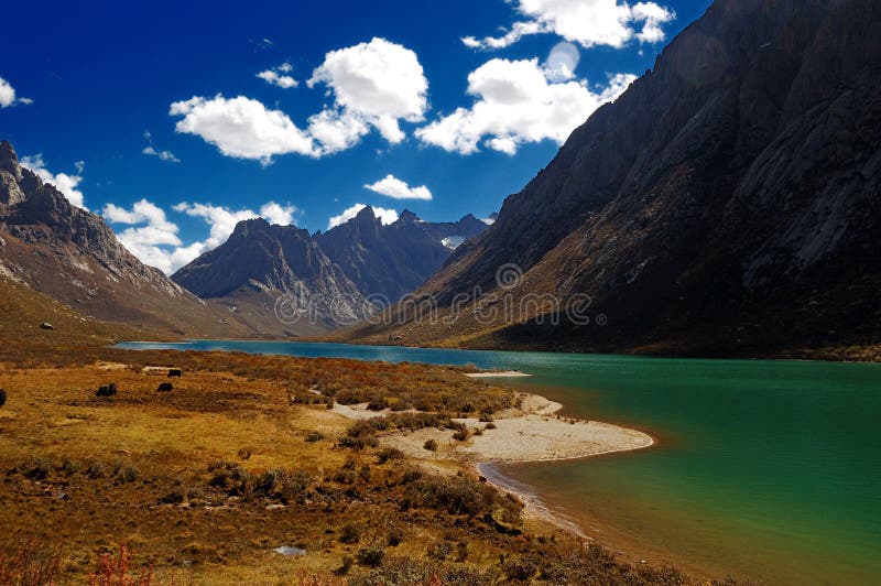 Green lake water and mountains