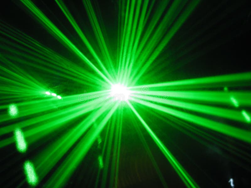 Green laser beams on a black background. Green laser beams on a black background.