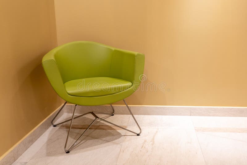 Green Leather Chair in Modern Interior Standing in Corner Stock Photo