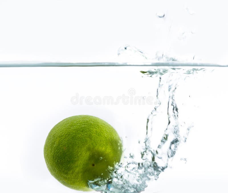 Green Lemon Falling into the Water Stock Photo - Image of juice, ripe ...