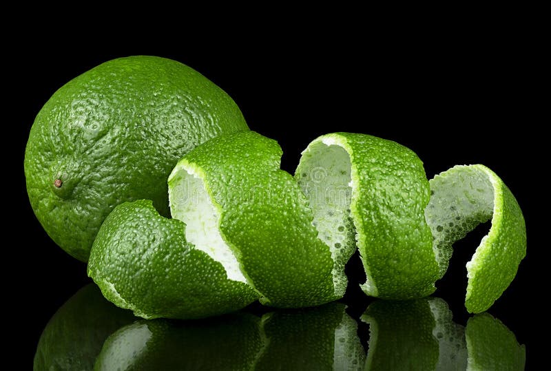Green Lime and Lime Peel on Black Background. Citrus Fruit Stock Image