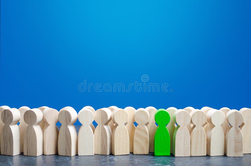 A green man stands out from the crowd. Talented and skillful suitable candidate. Initiative and active person, leader. Employee of. The month. Best choice of stock photography A green man stands out from the crowd. Talented and skillful suitable candidate. Initiative and active person, leader. Employee of. The month. Best choice of stock photography