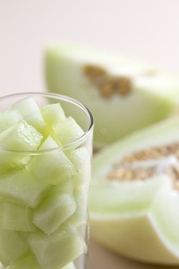 Green melon pieces in a glass