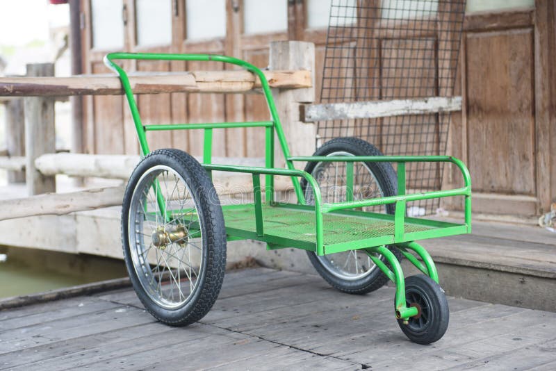 Green metal cart wheels stock photo. Image of green, transport 75491296