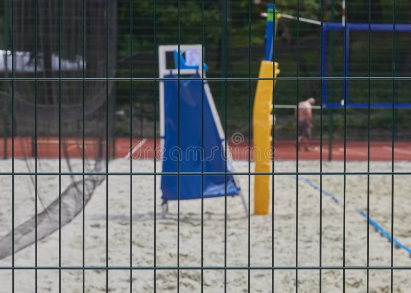 Green metal lattice. Green metal fence. Volleyball court background. Lattice wire stock images, royalty-free photos and pictures