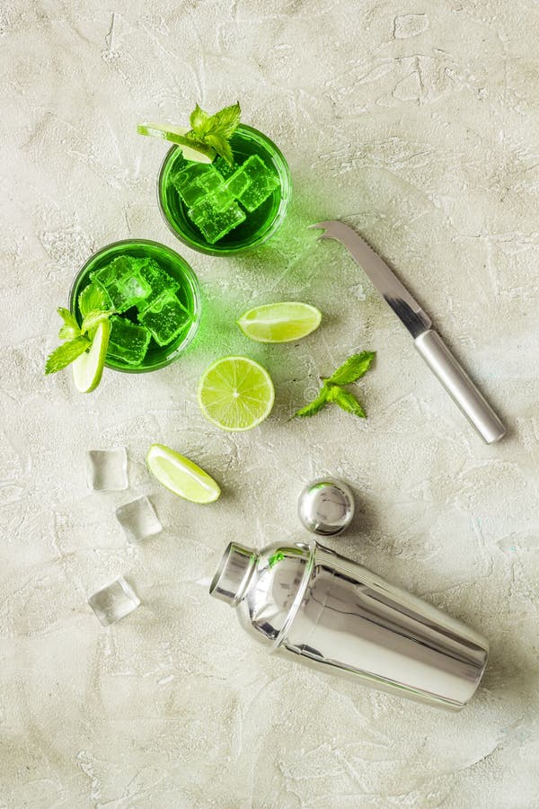 Green Mojito Cocktail with Bar Utensils and Ingredients. Top View Stock