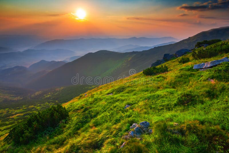 Green mountain valley at the sunrise