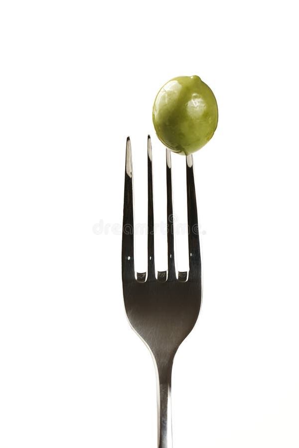 Green olive on a fork