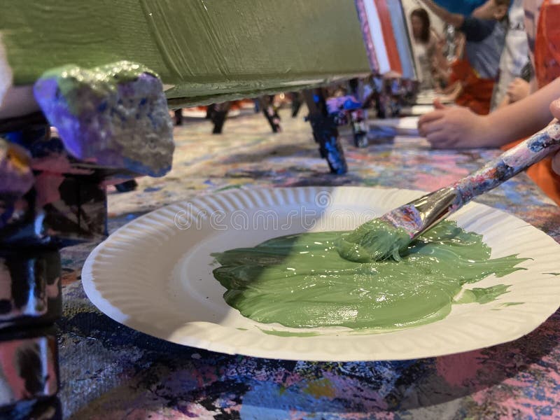 Green paint on a plate stock photo. Image of craft, crayon 179445906