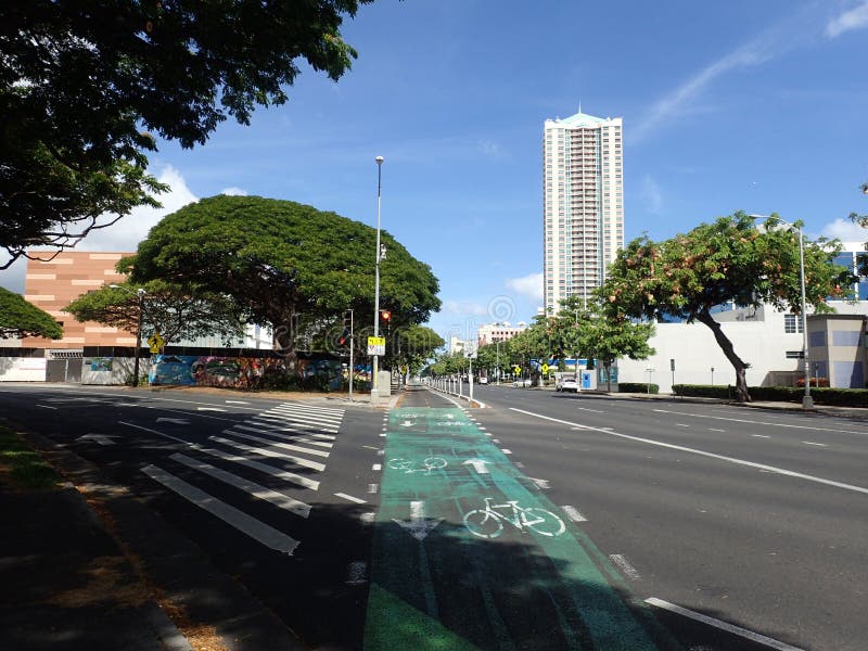 Honolulu - August 6, 2017: Green Painted King Street Protected Bike Lane intersecting roads in Downtown Honolulu