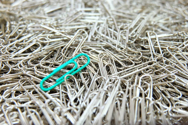Green Paper Clip on Paper Clips Background. Stock Image Image of