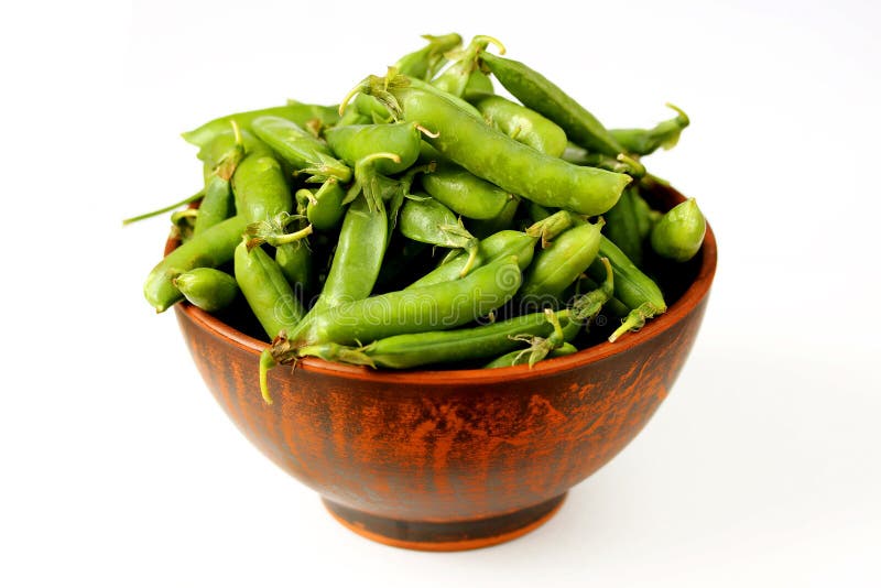 Green Peas in a Clay Bowl on a Wooden Background Stock Image - Image of