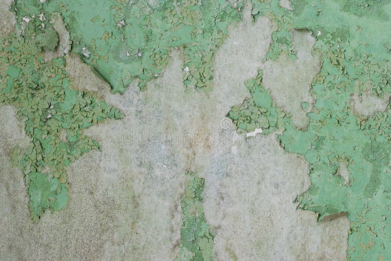 Green Peeling Paint on the Wall. Old Concrete Wall with Cracked Flaking Paint Stock Photo