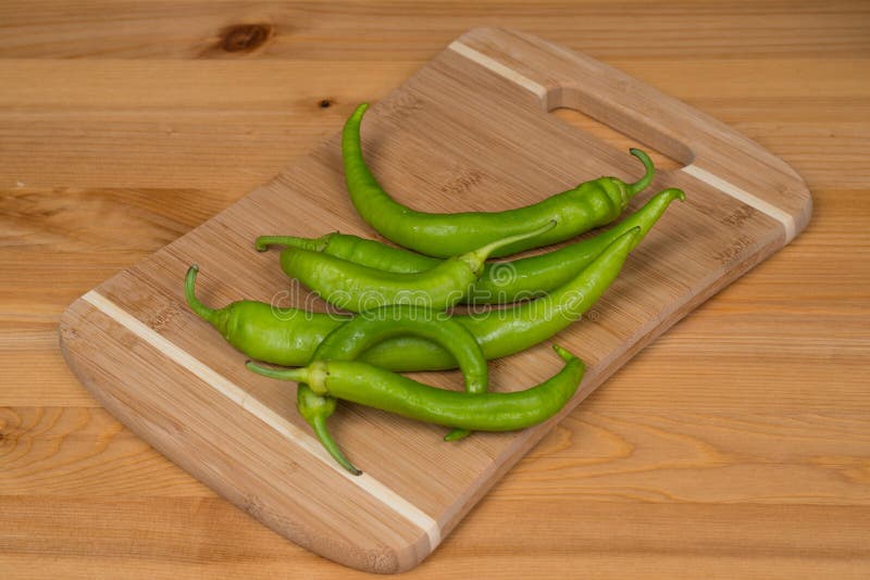 Green Peppers on a Cutting Board Stock Image Image of cooking, ripe