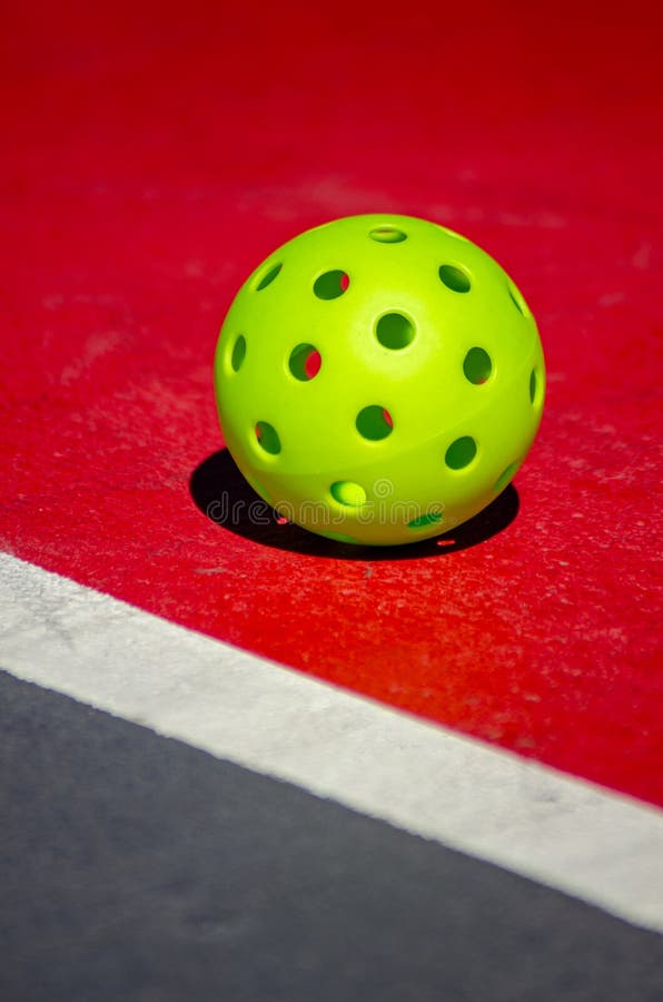 Green Pickleball Ball on a Red Court Stock Photo Image of pickle