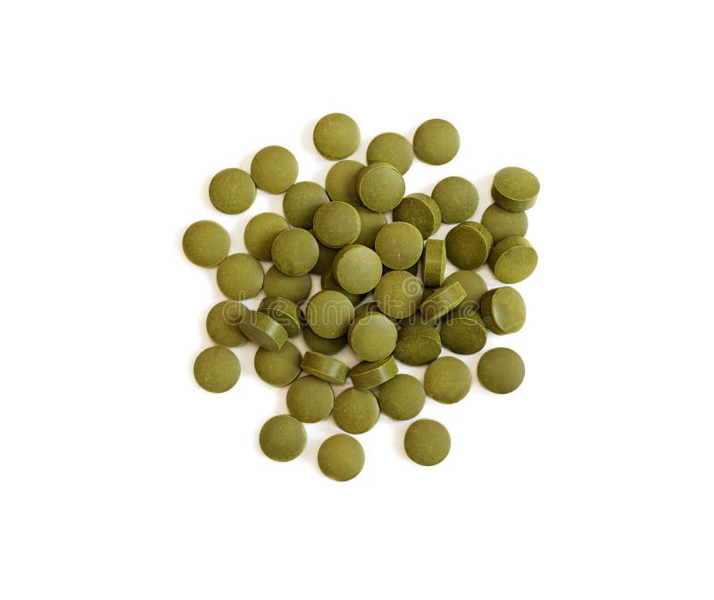 Green pills. Herbal green tablets royalty free stock images