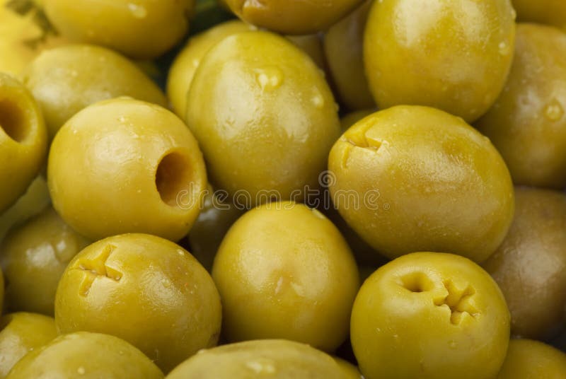 Green pitted olives stock image. Image of conserved, pile 10605523