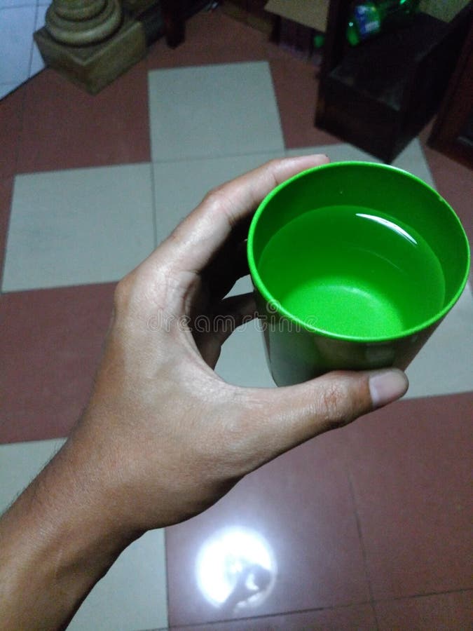 Plastic cup hold by hand stock photo. Image of plastic 152511080