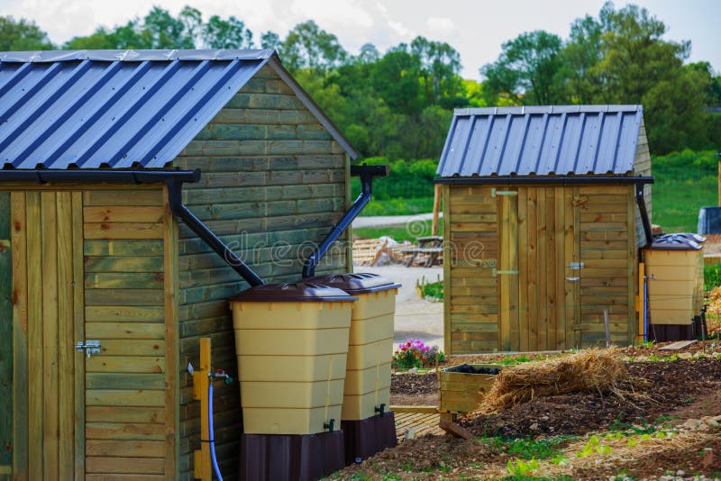 Green recovery of rainwater outside in town garden with small wo royalty free stock image Green recovery of rainwater outside in town garden with small wo royalty free stock image