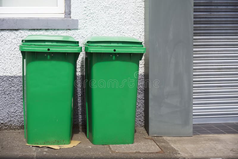 Green Recycle Wheelie Bins in Row for Collection Stock Image Image of