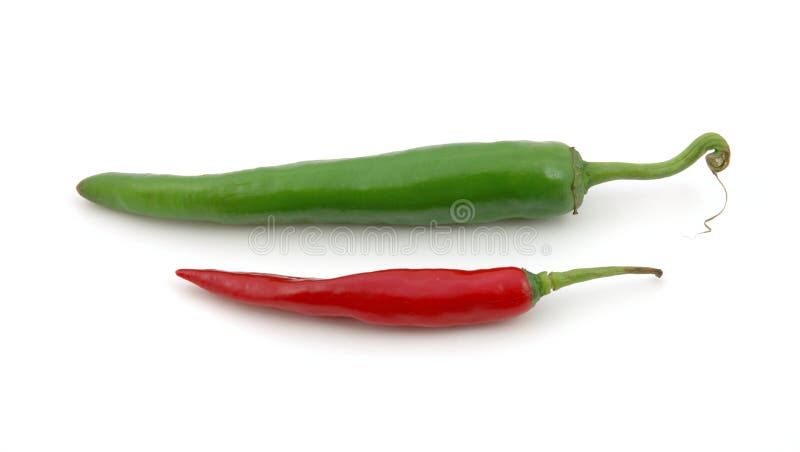 Green and red hot chili peppers in isolated white background