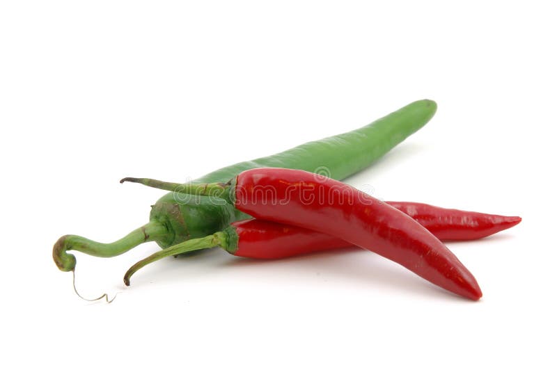 Green and red hot chili peppers in isolated white background