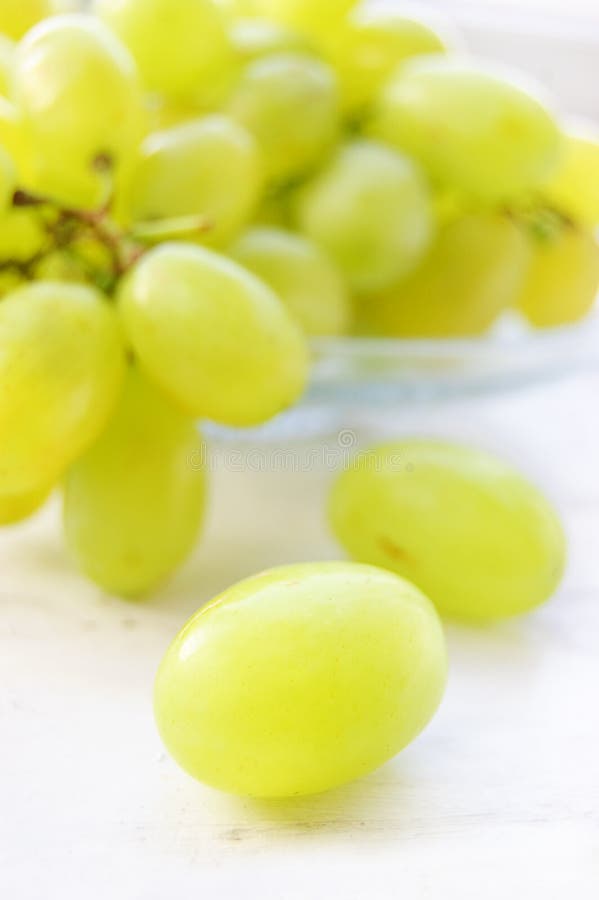 Green ripe grapes in plate