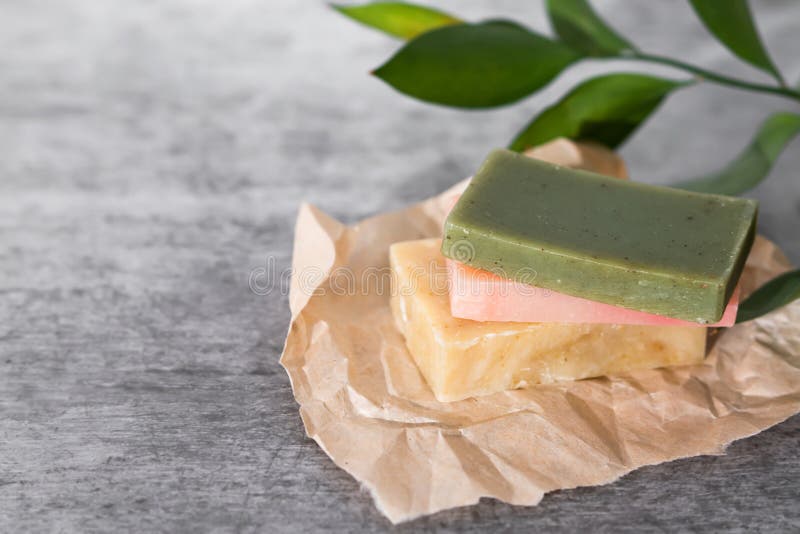 Green, Rose and Yellow Soaps with a Fresh Green Leaves in a Romantic