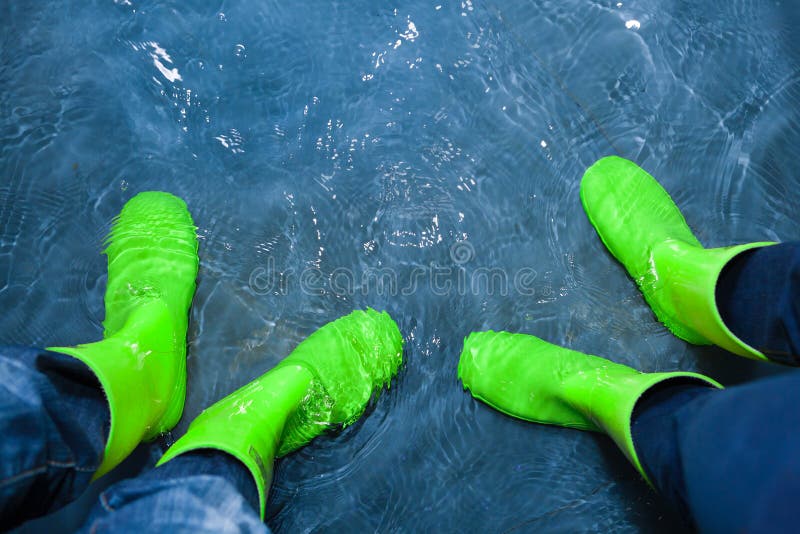 Rubber boots in the water stock photo. Image of protection 28114358