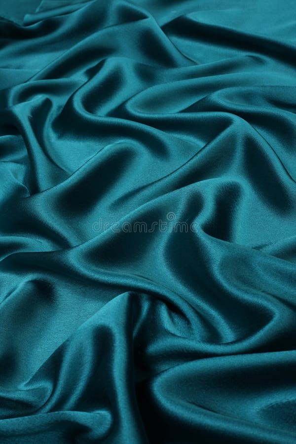 Green satin silky smooth background with foldings. Green satin silky smooth background with foldings
