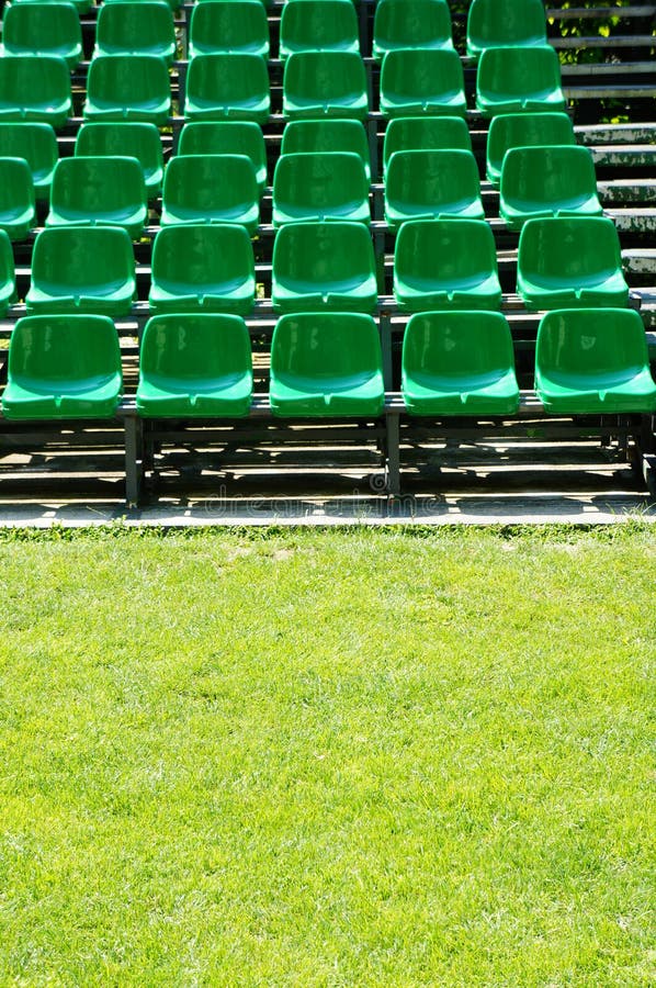 Green seats stock photo. Image of field, shadows, chairs 32556782