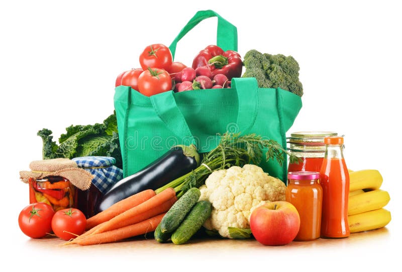 Green shopping bag with assorted grocery products stock photography