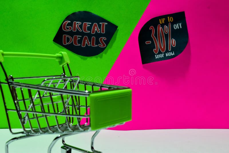 Green shopping cart. attached Great Deals and Up To 30% Off Shop Now text on green and pink background royalty free stock photos Green shopping cart. attached Great Deals and Up To 30% Off Shop Now text on green and pink background royalty free stock photos